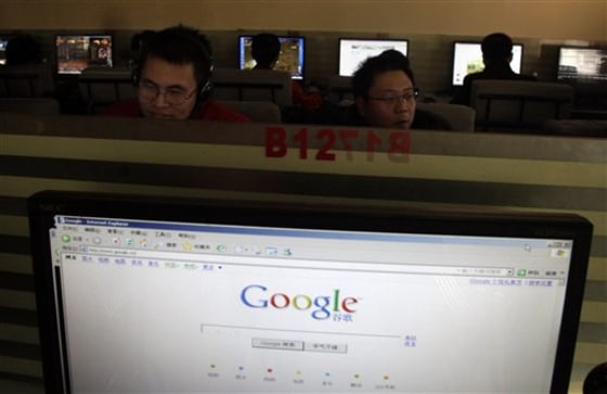 A Microsoft Internet Explorer browser displays the Google Web site as men work on computers in Beijing on Jan. 23.